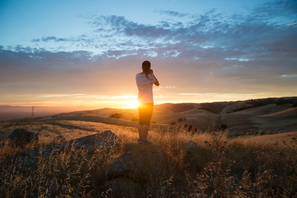man stands on field
